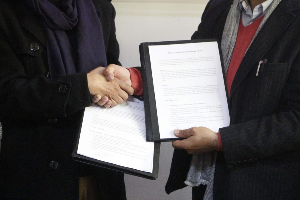 MOU signing handshake