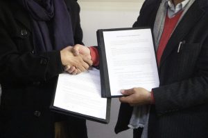 MOU signing handshake